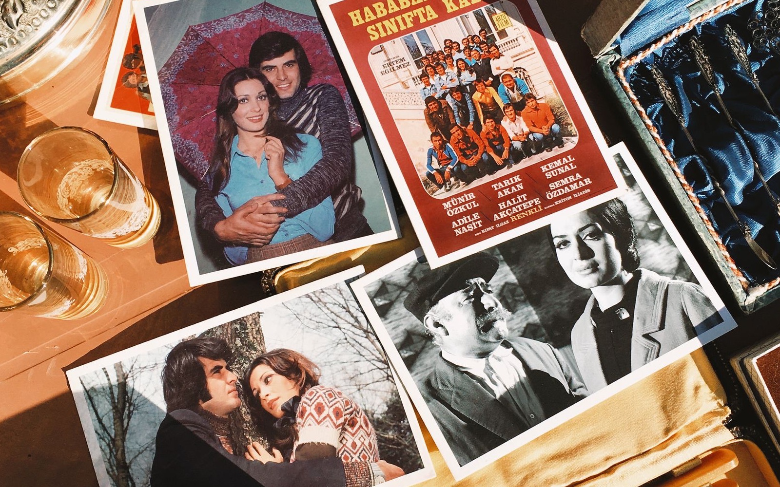 Old photographs and personal keepsakes arranged on a family table